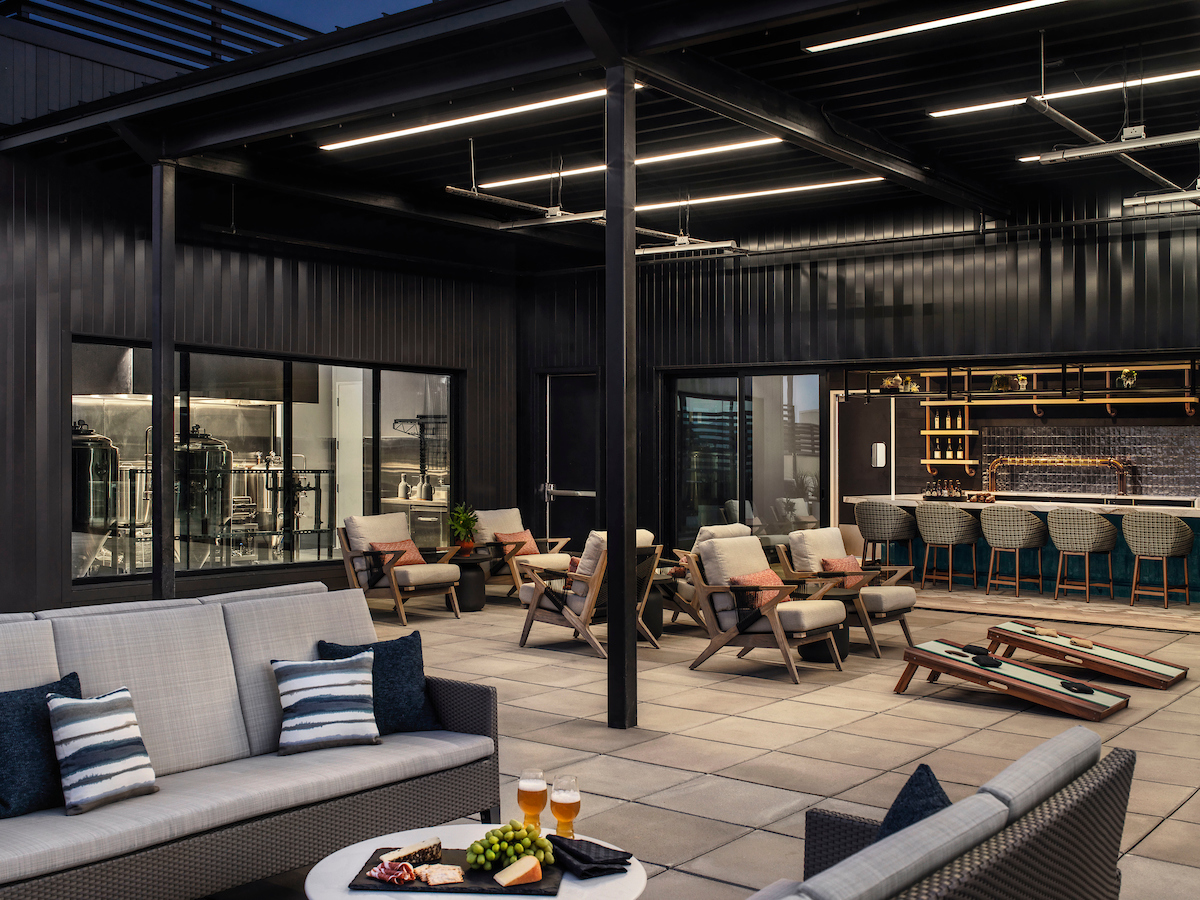 Senior living community, Friendship Village Tempe, microbrewery patio with food, games and outdoor seating.