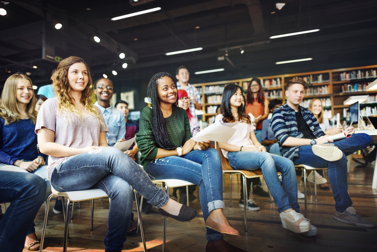 Happy high school students in a classroom