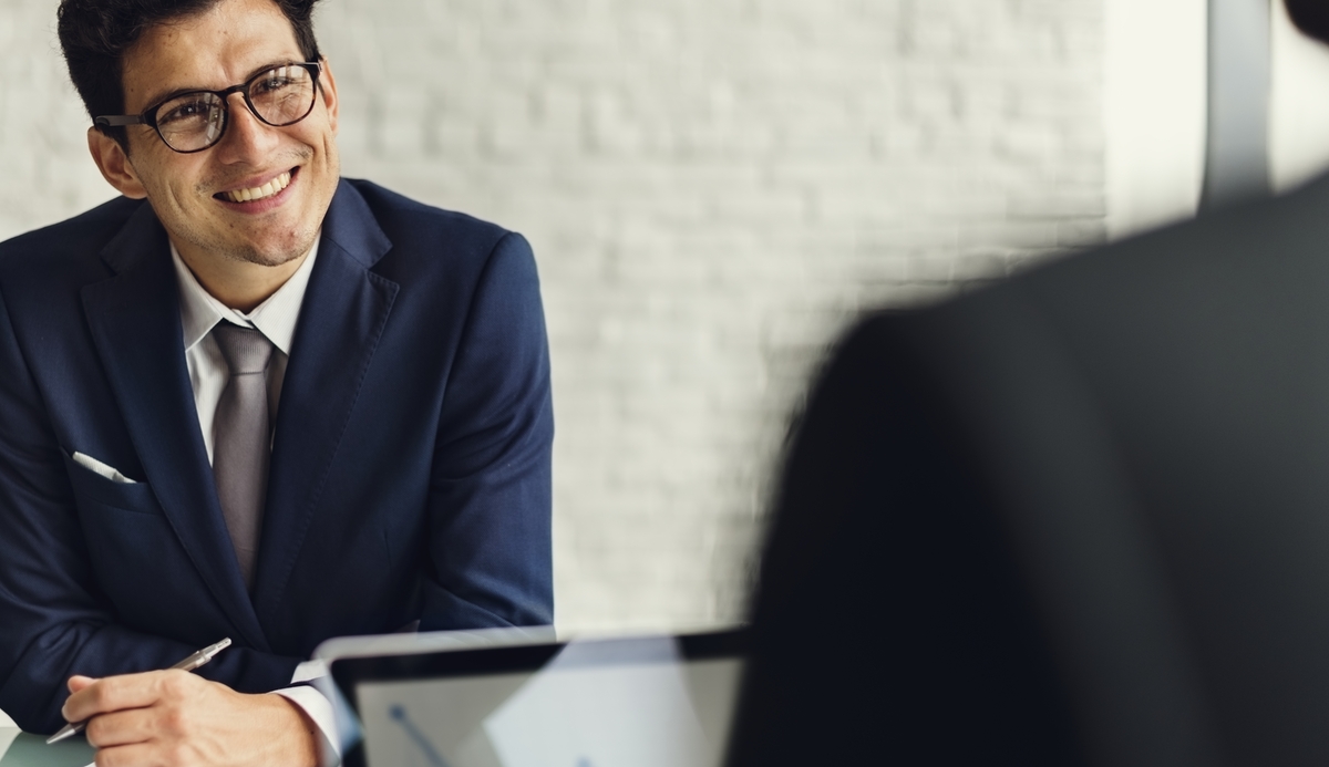 Business person smiling in a meeting